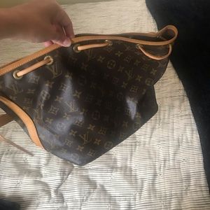 . Genuine Louis Vuitton.